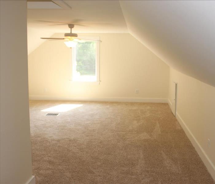 Loft with carpet and ceiling fan 