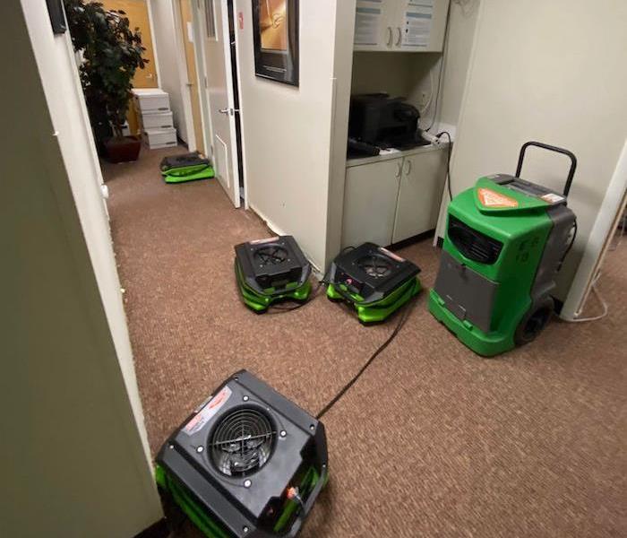 Office with SERVPRO drying and dehumidification equipment