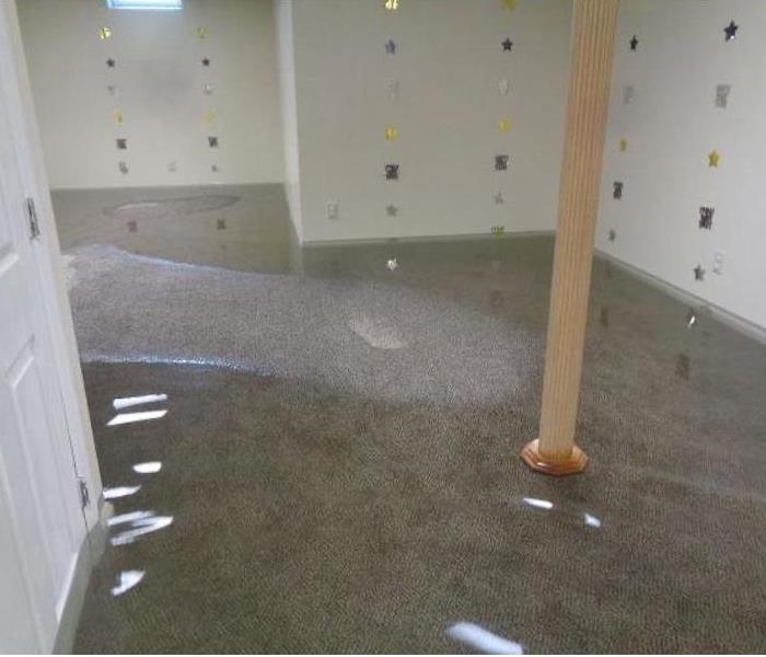 Basement with standing water around support poles