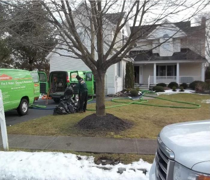 technicians restoring home after damage