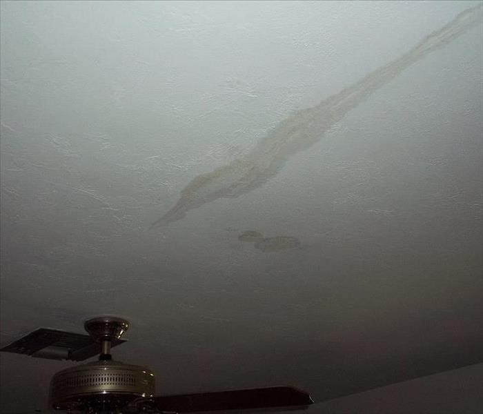 Ceiling with water damage stain