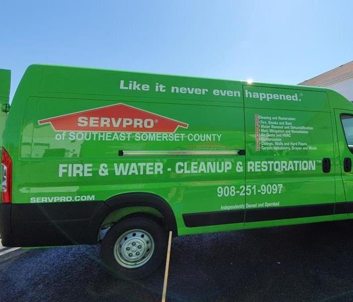 A SERVPRO vehicle parked in a parking lot. 