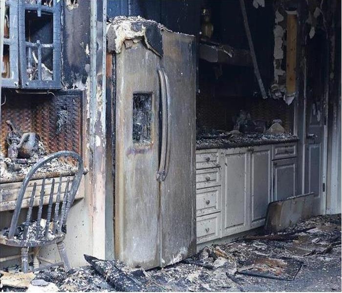 fire damaged kitchen and fridge