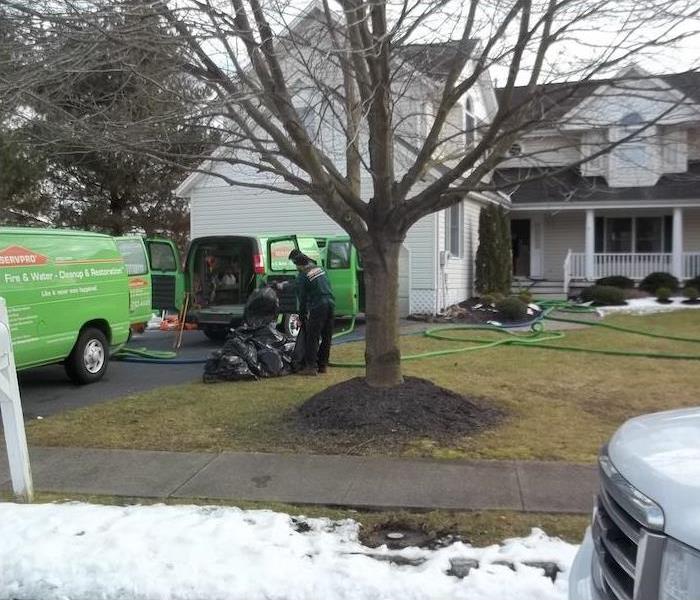 SERVPRO vehicles and technicians hard at work.